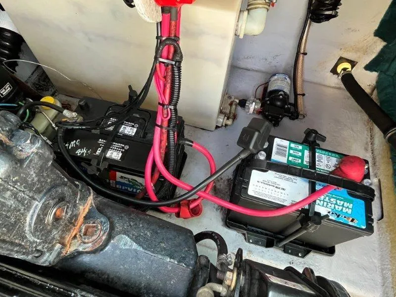 Slide: The Image of 1996 Chaparral Sunesta 250 boat battery compartment with wiring and components. - 34