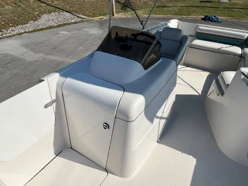 Slide: The Image of 1996 Chaparral Sunesta 250 boat interior with helm and seating area. - 42
