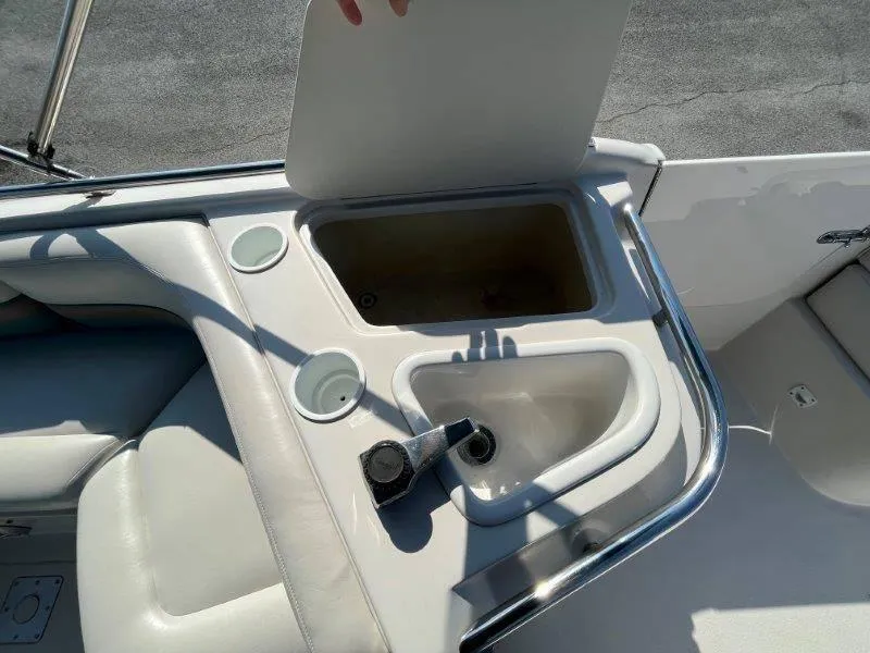 Slide: The Image of 1996 Chaparral Sunesta 250 boat interior with sink and storage compartment. - 43