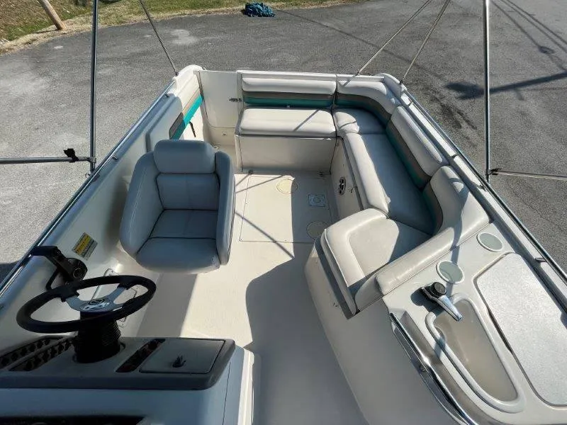 Slide: The Image of 1996 Chaparral Sunesta 250 boat interior with seating and steering wheel. - 48