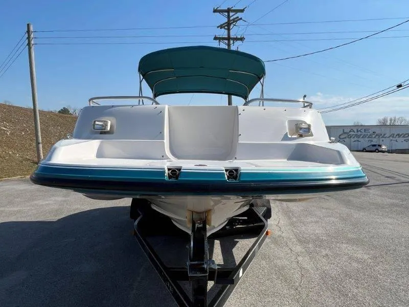 Slide: The Image of 1996 Chaparral Sunesta 250 boat on trailer, front view, with canopy. - 8