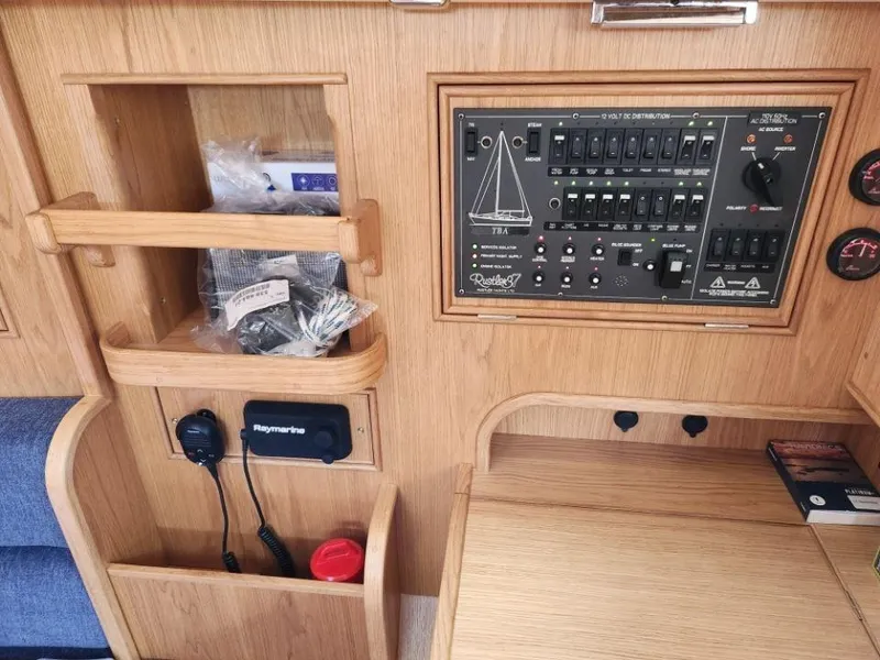 Slide: The Image of Control panel and storage in a 2025 Rustler 37 yacht interior. - 28
