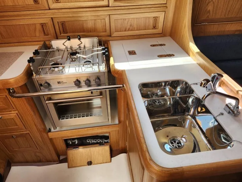 Slide: The Image of Modern kitchen in 2025 Rustler 37 yacht with stove, oven, and dual sink. - 35