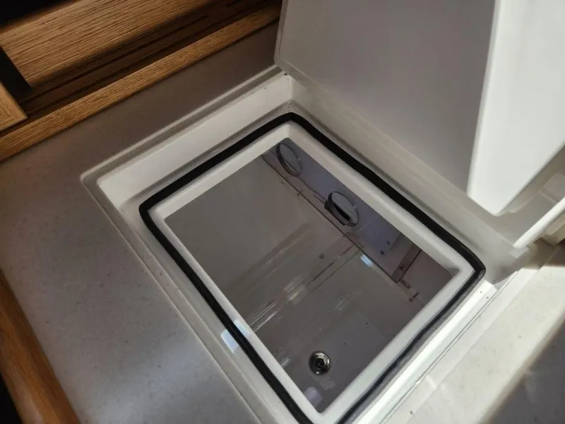 Slide: The Image of Built-in storage compartment on a 2025 Rustler 37 yacht, featuring a sleek, modern design. - 37