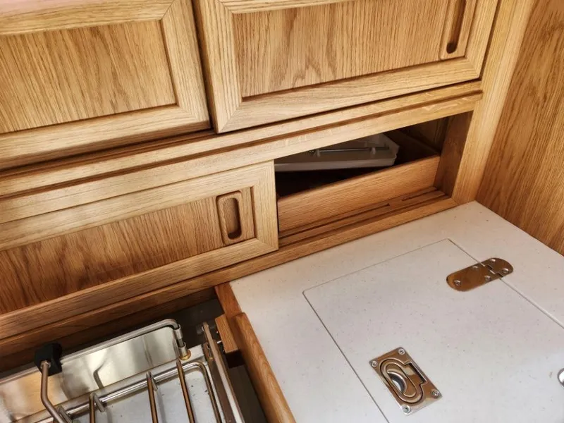 Slide: The Image of Wooden cabinetry and storage in a 2025 Rustler 37 yacht interior. - 41