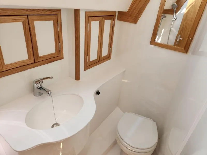 Slide: The Image of Modern bathroom in 2025 Rustler 37 yacht with wooden accents and sleek fixtures. - 43