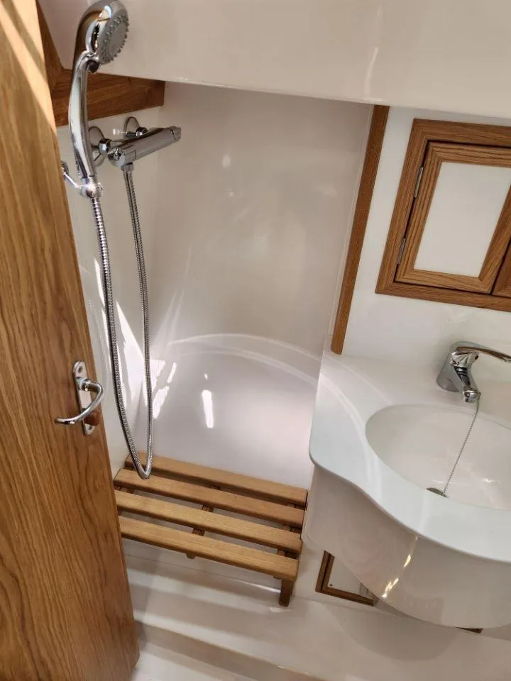 Slide: The Image of Modern bathroom in 2025 Rustler 37 yacht with wooden accents and sleek fixtures. - 44