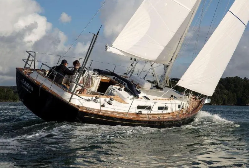 Slide: The Image of Sailing yacht Rustler 37, 2025 model, navigating through water with full sails. - 5