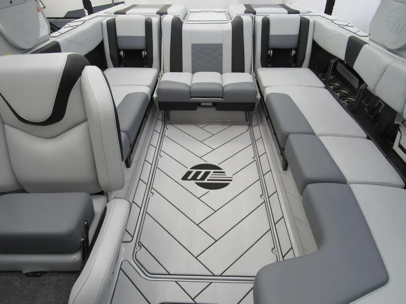 Slide: The Image of Luxurious interior of 2025 Malibu 23 LSV boat with stylish seating and flooring design. - 13