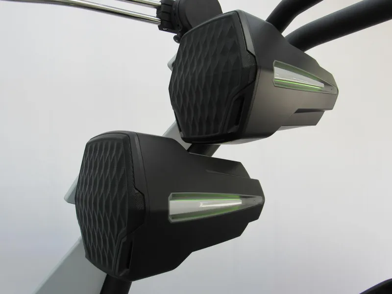 Slide: The Image of 2025 Malibu 23 LSV boat speakers with sleek black design and green accents. - 15