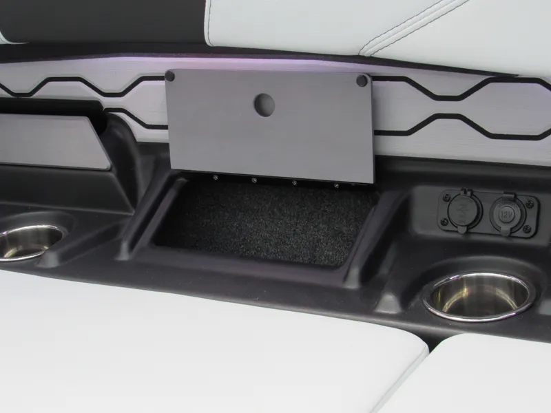 Slide: The Image of 2025 Malibu 23 LSV interior detail with cup holders and sleek design. - 6