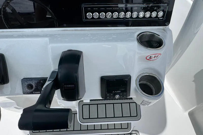 Slide: The Image of Control panel of 2025 Tidewater 210 LXF boat with Yamaha throttle and JL Audio system. - 11