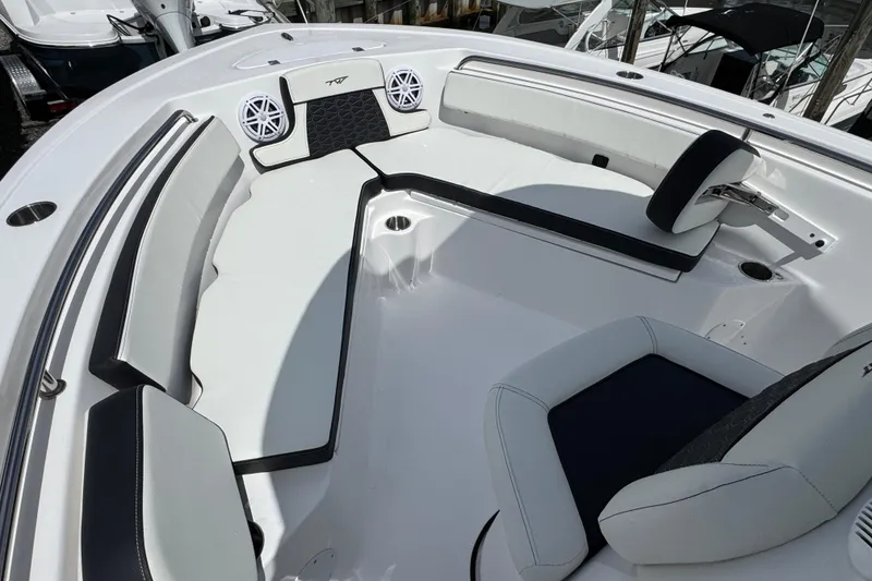 Slide: The Image of 2025 Tidewater 210 LXF boat interior with white seating and modern design. - 15