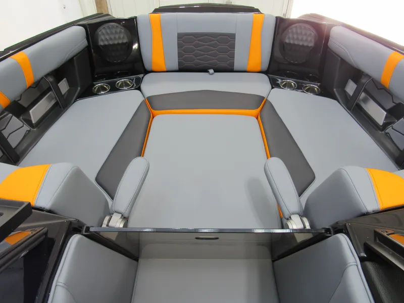 Slide: The Image of 2025 Malibu Wakesetter 22 MXZ interior with gray and orange seating. - 17