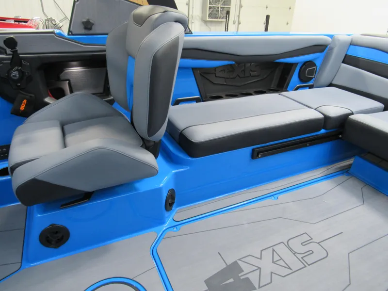 Slide: The Image of 2025 Axis A225 boat interior with blue and gray seating, modern design. - 10