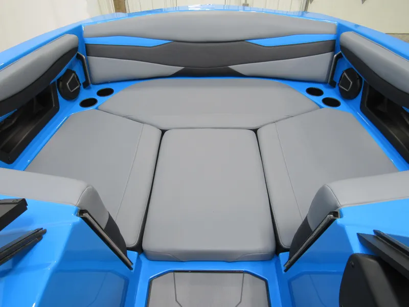 Slide: The Image of 2025 Axis A225 boat interior with blue and gray seating. - 13
