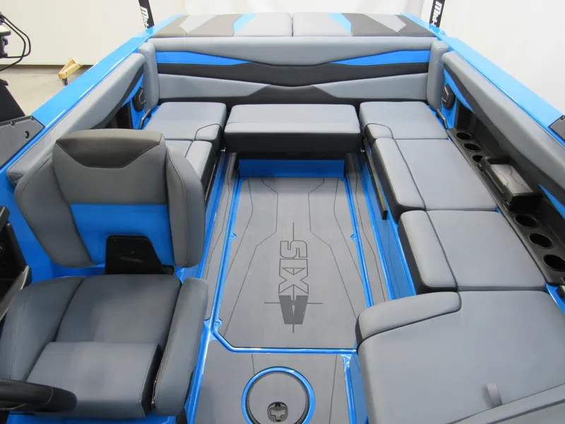 Slide: The Image of 2025 Axis A225 boat interior with blue and gray seating, spacious layout. - 14