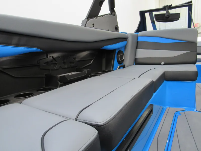 Slide: The Image of 2025 Axis A225 boat interior with gray and blue seating. - 9