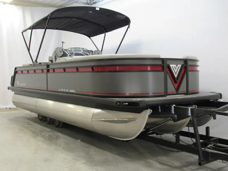 Slide: The Image of 2025 Viaggio Lago X22U pontoon boat with canopy in showroom. - 1