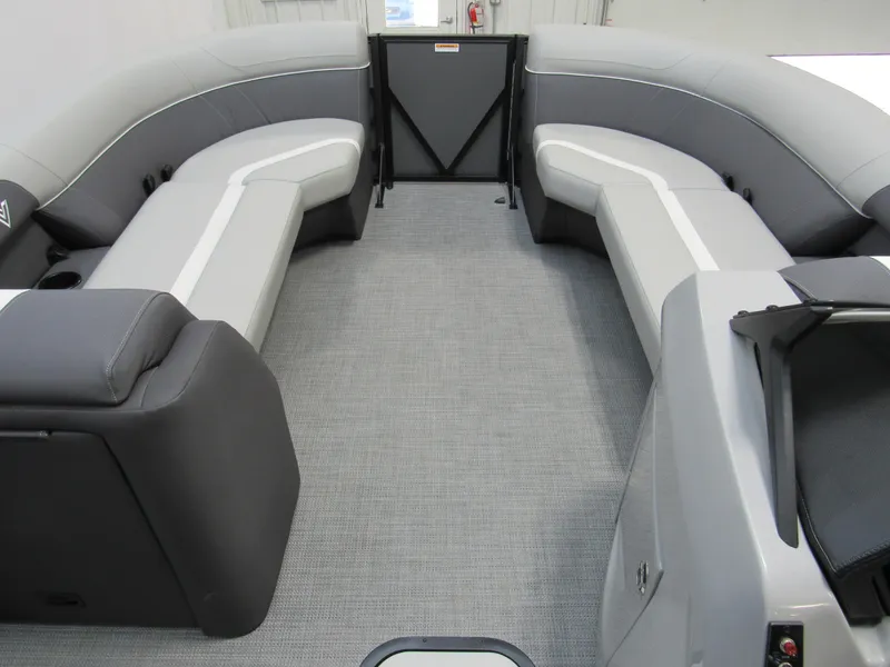 Slide: The Image of 2025 Viaggio Lago X22U boat interior with gray seating and carpet flooring. - 8
