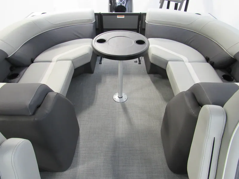 Slide: The Image of Viaggio Lago X22U 2025 boat interior with gray seating and round table. - 9