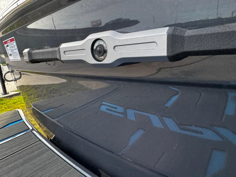 Slide: The Image of 2025 Supra SE 550 boat with sleek black exterior and modern design. - 12