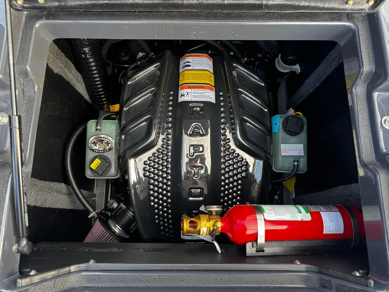Slide: The Image of 2025 Supra SE 550 engine compartment with Raptor engine and fire extinguisher. - 20