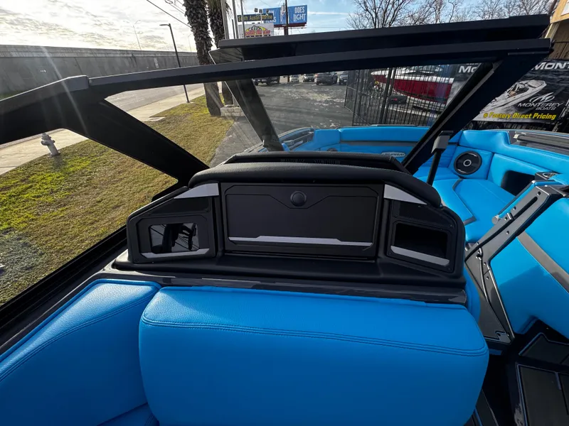 Slide: The Image of 2025 Supra SE 550 boat interior with blue seating and modern dashboard. - 34