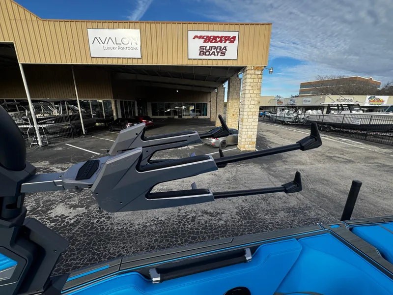 Slide: The Image of 2025 Supra SE 550 boat at dealership, showcasing sleek design and modern features. - 37