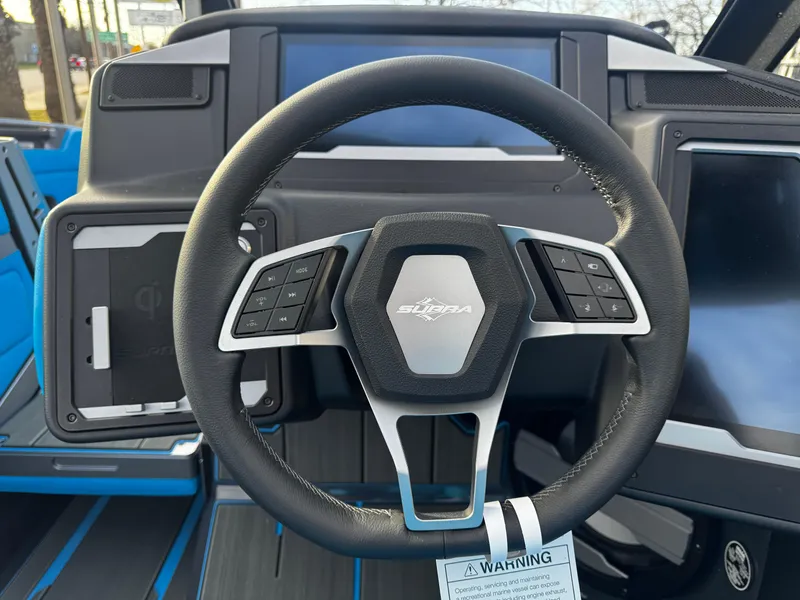 Slide: The Image of 2025 Supra SE 550 steering wheel with modern dashboard controls. - 45