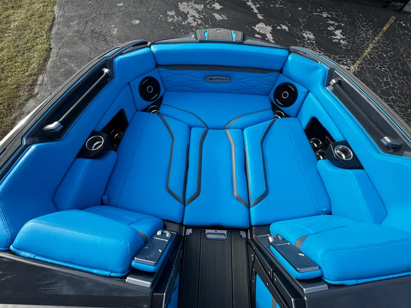 Slide: The Image of 2025 Supra SE 550 boat interior with vibrant blue seating and sleek design. - 47
