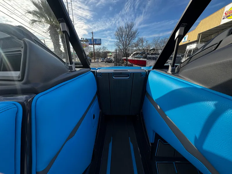 Slide: The Image of 2025 Supra SE 550 interior with blue seating and modern design. - 48