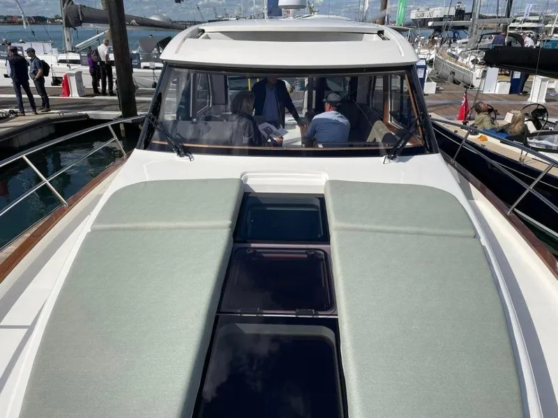 Slide: The Image of 2025 Rustler 41 yacht at marina, showcasing sleek deck design and modern features. - 10