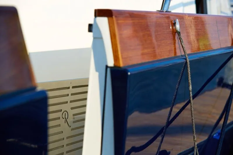 Slide: The Image of 2025 Rustler 41 yacht detail with polished wood and sleek design. - 15