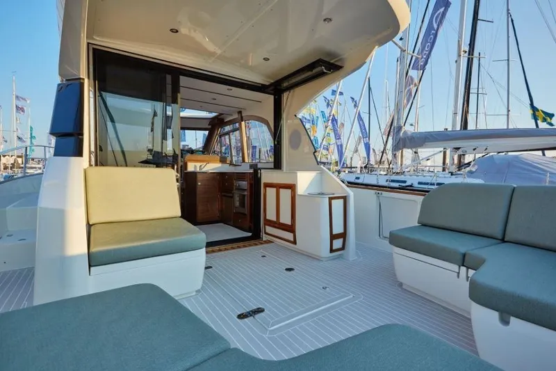 Slide: The Image of Luxurious 2025 Rustler 41 yacht interior with comfortable seating and modern design. - 21