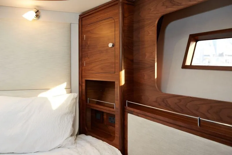 Slide: The Image of Luxurious cabin interior of 2025 Rustler 41 yacht with wooden finish and cozy bedding. - 28