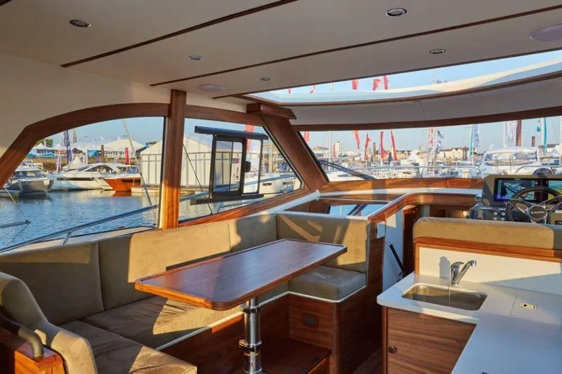 Slide: The Image of Luxurious interior of 2025 Rustler 41 yacht with marina view. - 29