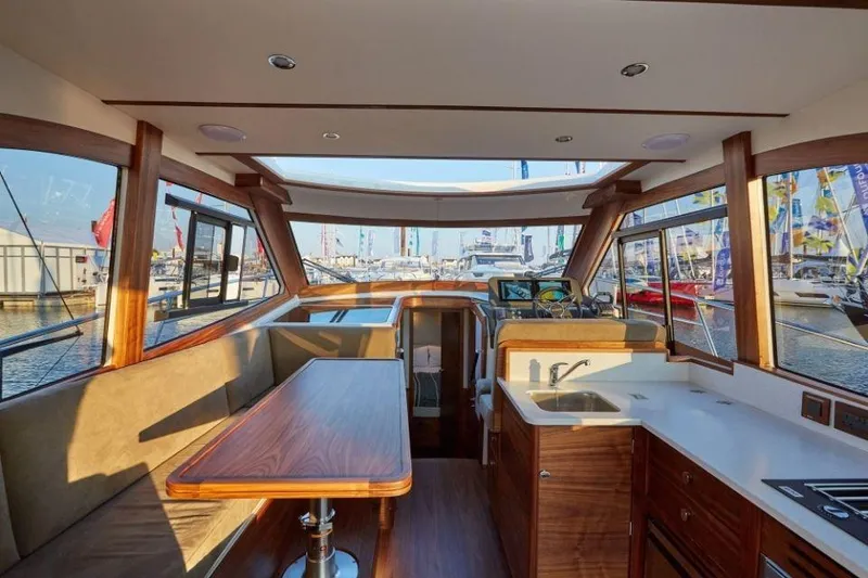 Slide: The Image of Luxurious interior of 2025 Rustler 41 yacht with wooden finishes and panoramic windows. - 30