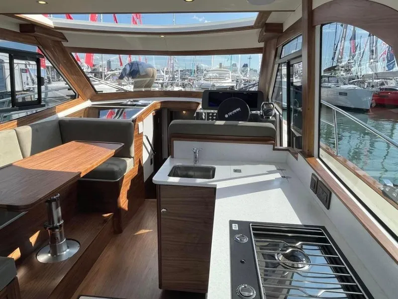 Slide: The Image of Interior of 2025 Rustler 41 yacht with modern kitchen and seating area. - 36