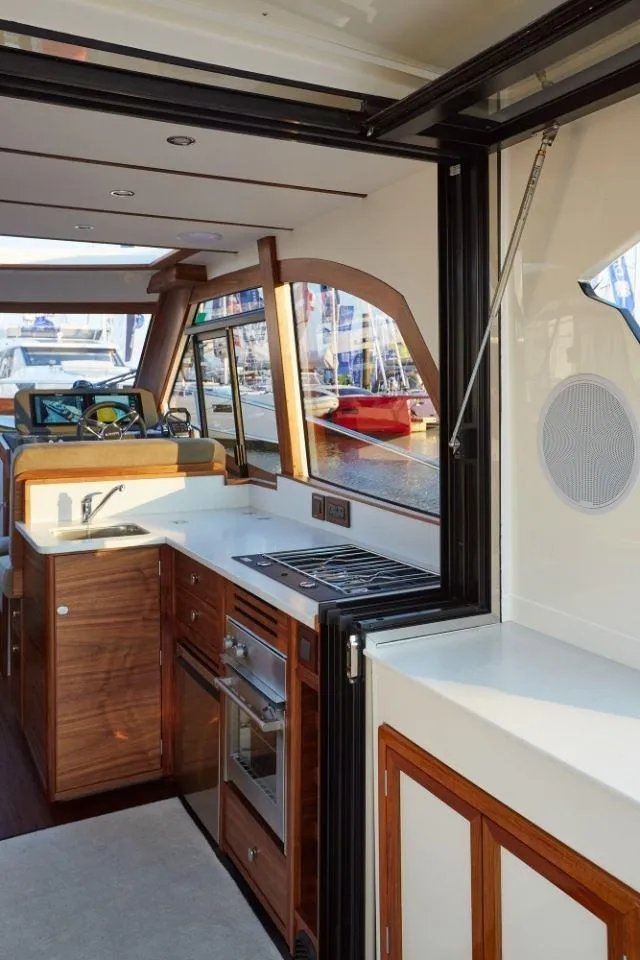 Slide: The Image of Interior of 2025 Rustler 41 yacht with modern kitchen and sleek design. - 39