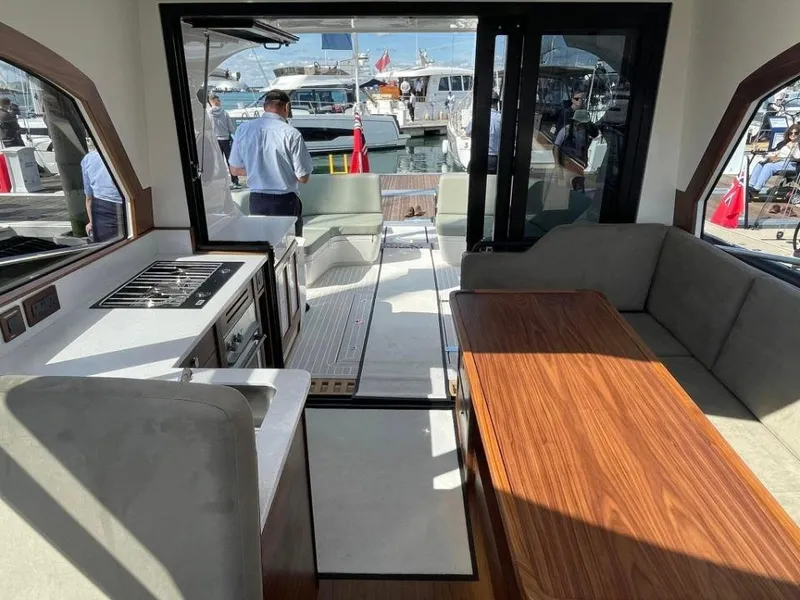 Slide: The Image of Interior of 2025 Rustler 41 yacht with modern kitchen and seating area. - 40