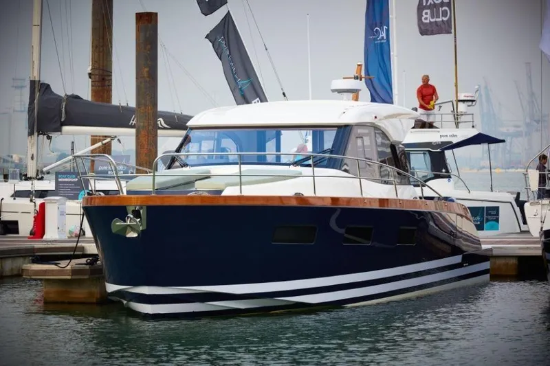 Slide: The Image of 2025 Rustler 41 yacht docked at marina, featuring sleek design and modern amenities. - 8