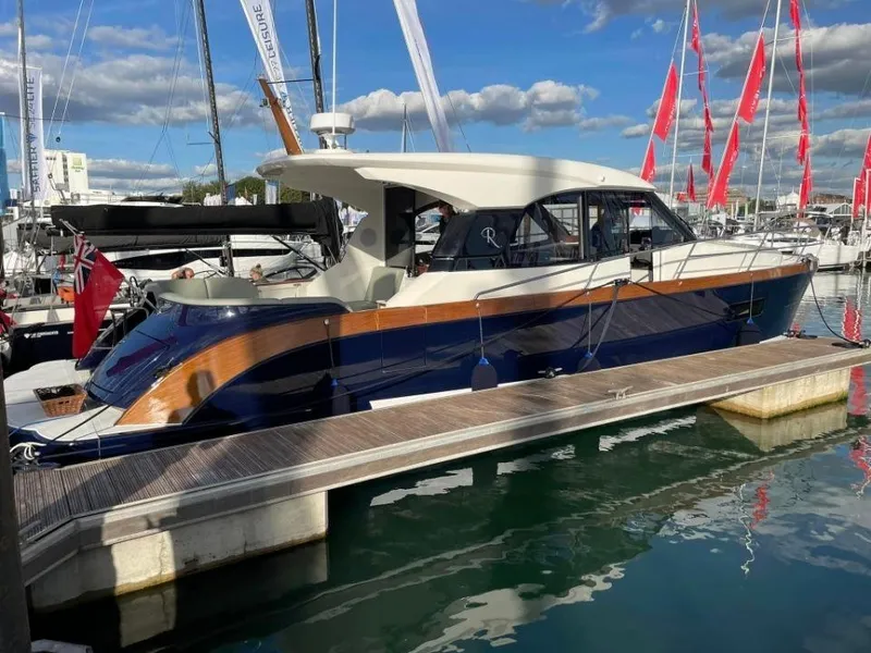 Slide: The Image of 2025 Rustler 41 yacht docked at marina, featuring sleek design and modern finishes. - 9