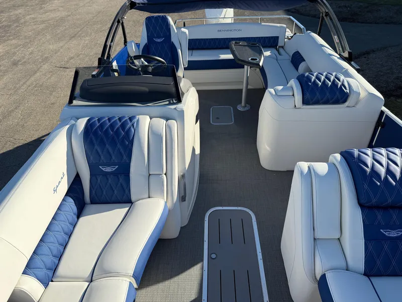 Slide: The Image of 2024 Bennington RX Sport Line boat interior with blue and white seating. - 3