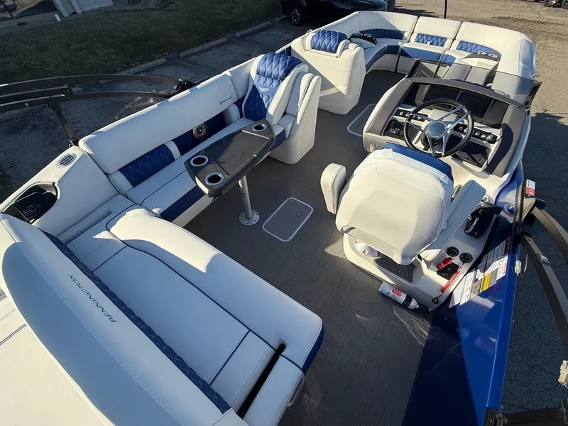 Slide: The Image of 2024 Bennington RX Sport Line boat interior with luxurious seating and modern dashboard. - 4