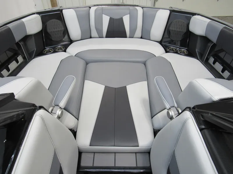 Slide: The Image of 2023 Malibu Wakesetter 23 MXZ interior with sleek gray and white seating. - 12
