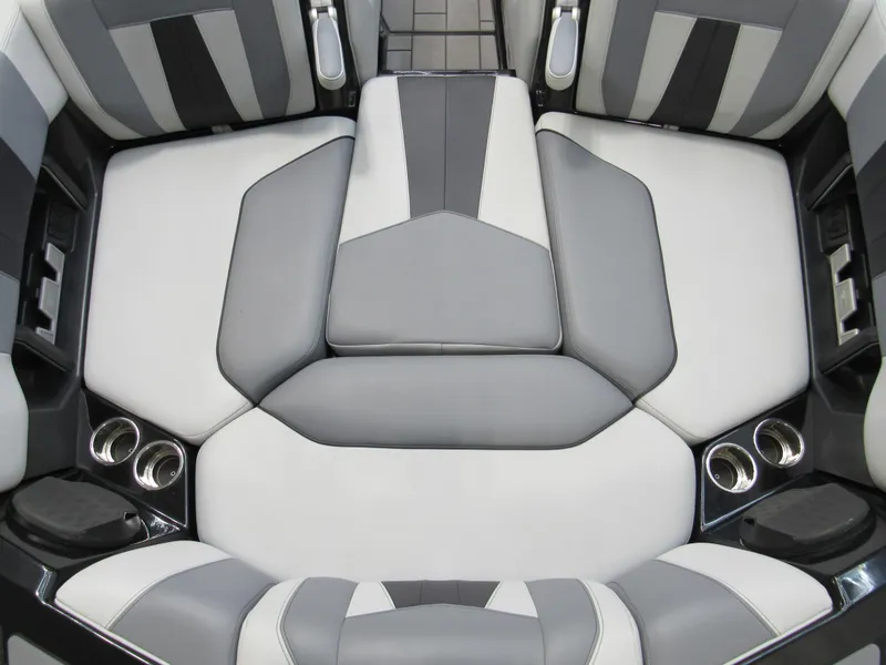 Slide: The Image of 2023 Malibu Wakesetter 23 MXZ interior seating with gray and white upholstery. - 14