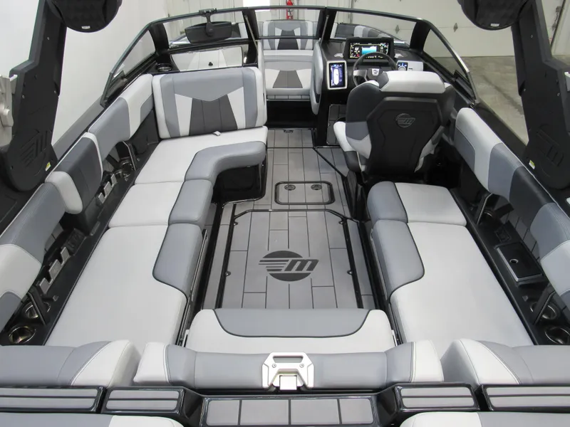 Slide: The Image of 2023 Malibu Wakesetter 23 MXZ interior with spacious seating and modern dashboard. - 4