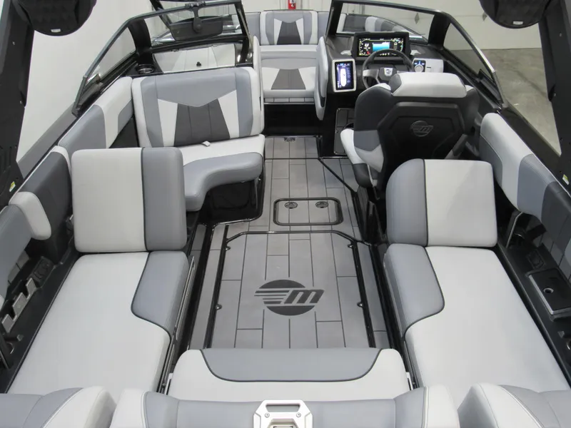 Slide: The Image of 2023 Malibu Wakesetter 23 MXZ interior with modern seating and dashboard design. - 5