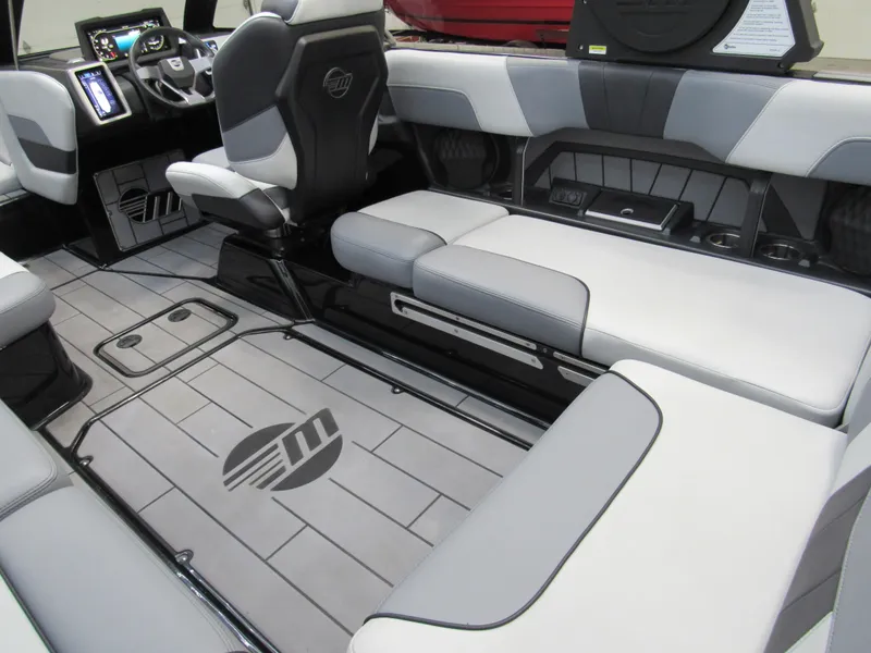 Slide: The Image of 2023 Malibu Wakesetter 23 MXZ interior with sleek seating and modern dashboard. - 7
